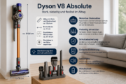 Dyson V8 Absolute an der Wandhalterung mit Zubehör und Übersicht zu Maßen, Saugleistung, Schutzabschaltung, Entleerung, Lautstärke und Akkulaufzeit.